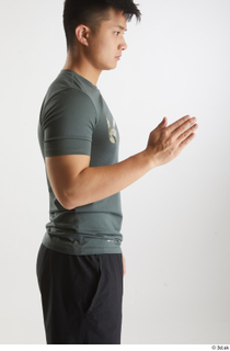 Yoshinaga Kuri  1 arm dressed flexing grey t shirt…